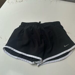 Nike girls athletic shorts. Elastic waist with draw string. Attatched lining.
